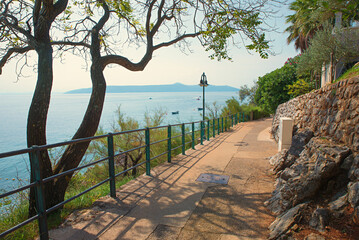seaside walkway Moscenicka Draga, croatian coast, view to Losinj island