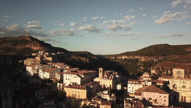 panoramic view of an old town on top of a cliff. drone shot of old historical buildings.