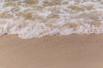 Fototapeta na wymiar sea waves washing on sandy beach
