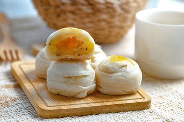 Chinese Pastry,Bean cake with salted egg yolk, on a wooden plate