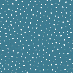 Doodle falling snow on navy blue sky background. Vector hand drawn seamless pattern. Background for wrapping, fabric, scrapbooking or wallpaper.