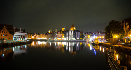 Fototapeta premium Picturesque summer evening panorama of the architectural pier of the Old Town GDANSK, POLAND