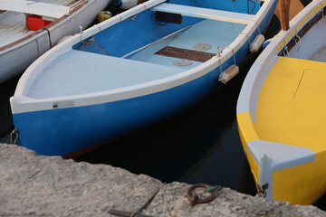 Fototapeta na wymiar Harbour with small fishing boats in Bardolino, Lake Garda, Italy