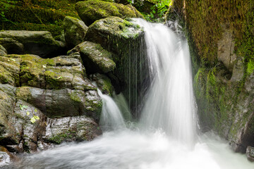 Long exposure of a waterfall on the Hoar Oak Water river at Watersmeet in Exmoor National Park