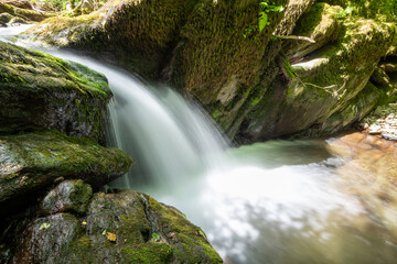 Long exposure of a waterfall on the Hoar Oak Water river at Watersmeet in Exmoor National Park