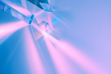 Glass prisms and cubes with color spectrum rays. Abstract background with reflection and refraction...