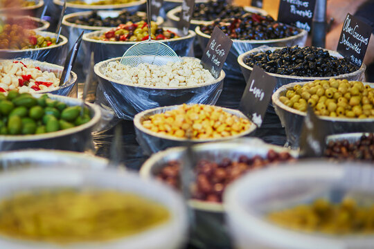 Olives and marinated garlic on a farmer market in Cucuron, France