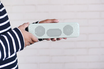 man's hand using smart speaker with copy space 
