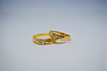 two golden wedding rings isolated in a white background