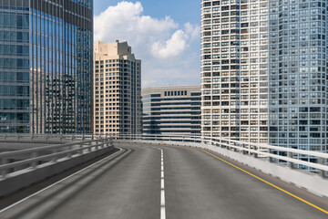 Fototapeta premium Empty urban asphalt road exterior with city buildings background. New modern highway concrete construction. Concept of way to success. Transportation logistic industry fast delivery. Chicago. USA.