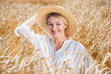 Portrait of a beautiful woman in a wheat field