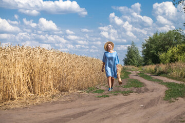 Village woman walking along a country road