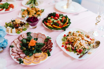 Fototapeta na wymiar Food on a festive table in a restaurant.