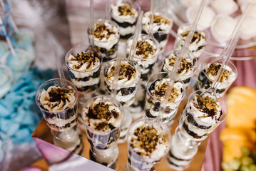 Chocolate mousse with nuts. Sweet homemade Parfait dessert with whipped cream. Top view.