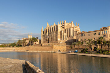 Palma de Mallorca, Spain. Facade and rose window called Ojo del Gotico (Gothic Eye) of the Santa Maria Cathedral, and Parc de la Mar