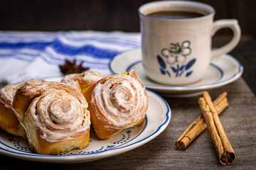 cup of coffee with cinnamon and cookies