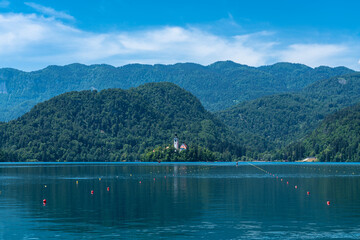Beautiful idyllic panorama view of Lake Bled with Bled Island, Church of the Mother of God and Slovenian Julian Alps in background in summer with blue sky cloud, Bled, Slovenia - 520366186