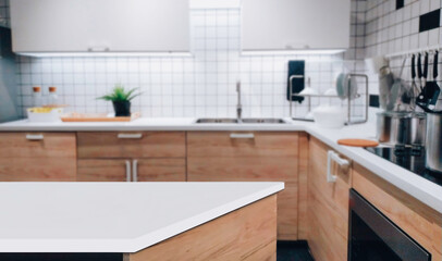 White marble texture table top on blurred kitchen background for montage or display your products..