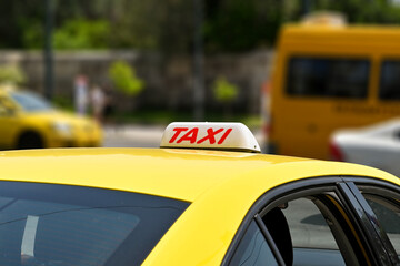 Sign on the roof of a yellow taxi in Greece