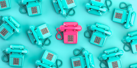 Pink vintage telephone on background from blue retro telephones. Contact us and support concept background.