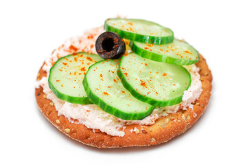 Crispy Cracker Sandwich with Fresh Cucumber, Fish Cream and Olives - Isolated on White. Easy...