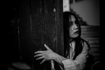 Portrait of asian woman make up ghost face with blood,Horror scene,Scary background,Halloween...
