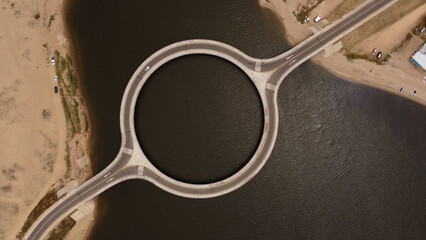 Aerial view orbiting unique Laguna Garzón Bridge, Uruguay