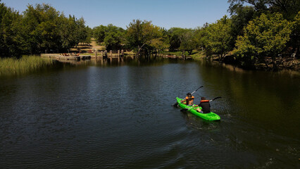 Couple kayaking on river, Cordoba in Argentina