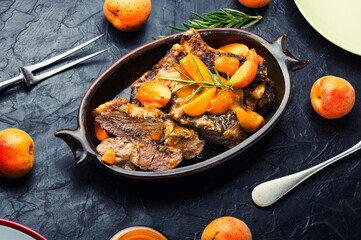 Fried pork ribs in fruit sauce.