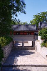 The clear sky, the wonderful tiled roof of Changdeokgung and the architecture Korean traditional old palace