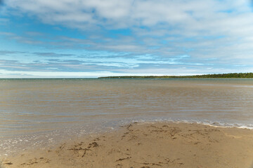 Singing Sands waters landscape, Bruce Peninsula National Park Ontario Canada. Large sandy beach on Lake Huron. White beach named after the sound the wind makes whistling through the dunes.