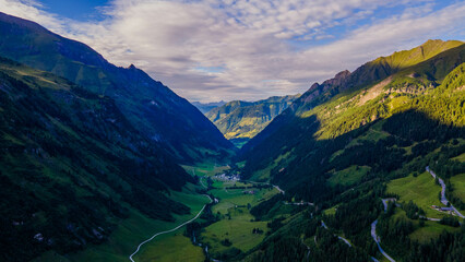 Aerial of Europe Alpes Austria Drone Summer, Scenic view of the Alps with a city down in the valley
