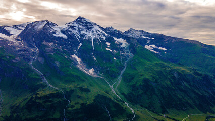 Aerial of Europe Alpes Austria Drone Summer, Scenic view of the Alps with a city down in the valley