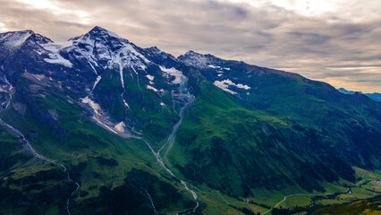 Aerial of Europe Alpes Austria Drone Summer, Scenic view of the Alps with a city down in the valley
