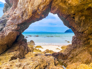 Fototapeta premium Koh Phayam beach Hin Talu with rock arch formation in Ranong, Thailand.