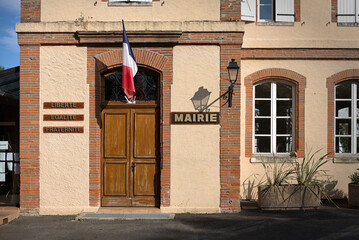 Town hall of French commune, with  national motto of France and the Republic of Haiti: Liberté,...