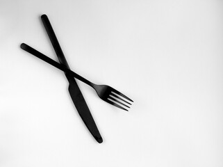 Black fork and knife isolated on white background