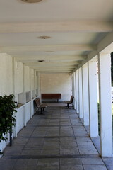 A narrow and long corridor on the lower floor of the building.