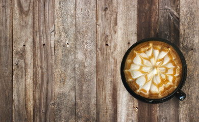 caramel honey star pattern on latte art coffee beverage