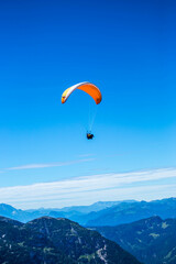 Fototapeta na wymiar skydiving in Schafberg by Sankt Wolfgang im Salzkammergut, Austria, perfect sky