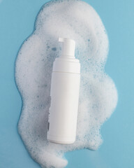 white cosmetic bottle with bubbles