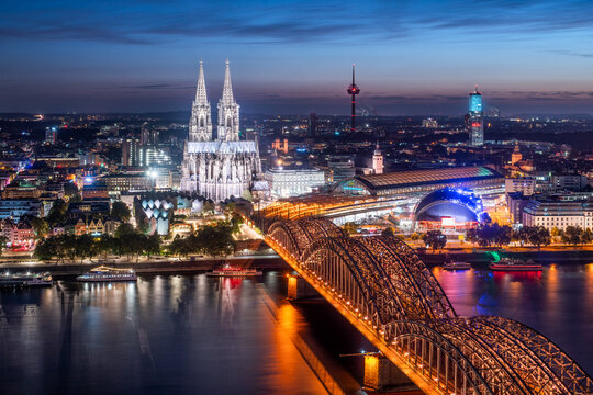 Aerial view of Cologne at night with view of Cologne Cathedral and Hohenzollern Bridge, North Rhine-Westphalia, Germany