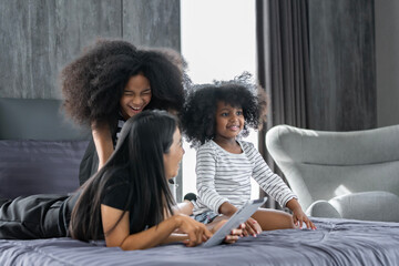 African family photo of parents and children doing activities together at home happily.