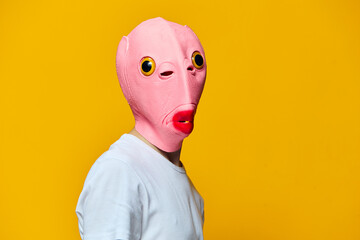 portrait of a man in a funny pink masquerade mask