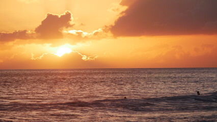 Sunset surfing in Maui Hawaii
