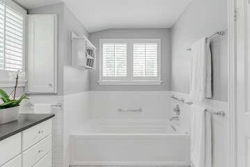 white modern country farmhouse bathroom interior design plantation shutters granite countertop sink...