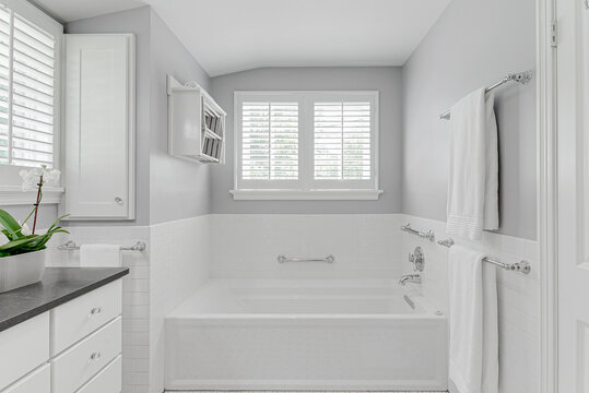 White Modern Country Farmhouse Bathroom Interior Design Plantation Shutters Granite Countertop Sink Tulips Stand In Shower And Tub