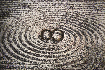 Fototapeta na wymiar Two wedding rings on the background of circles