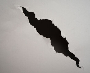 ripped hole in  paper background