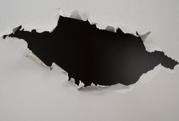 ripped hole in  paper background - obrazy, fototapety, plakaty